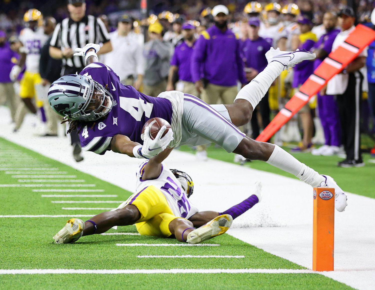 Kansas State Wildcats wide receiver Malik Knowles (4) scores on a touchdown reception during the TaxAct Texas Bowl on Jan. 4, 2022 in Houston, Texas.