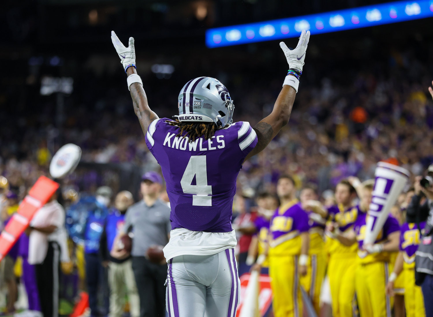 Kansas State Wildcats wide receiver Malik Knowles (4) gestures after a touchdown reception during the TaxAct Texas Bowl on Jan. 4, 2022 in Houston, Texas.