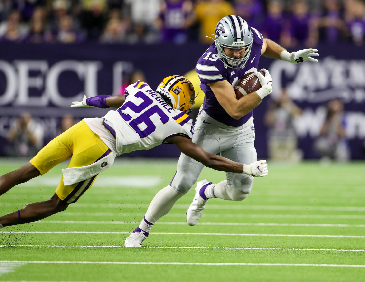 Kansas State Wildcats tight end Sammy Wheeler (19) works against LSU Tigers defensive back Damarius McGhee (26) on a carry during the TaxAct Texas Bowl on Jan. 4, 2022 in Houston, Texas.