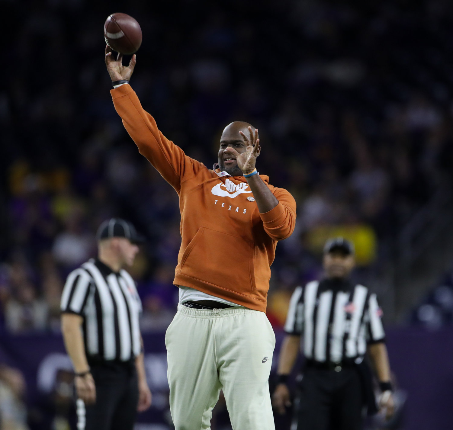 Texas Longorns legendary quarterback Vince Young throws the ball during an entertainment break in the TaxAct Texas Bowl on Jan. 4, 2022 in Houston, Texas.