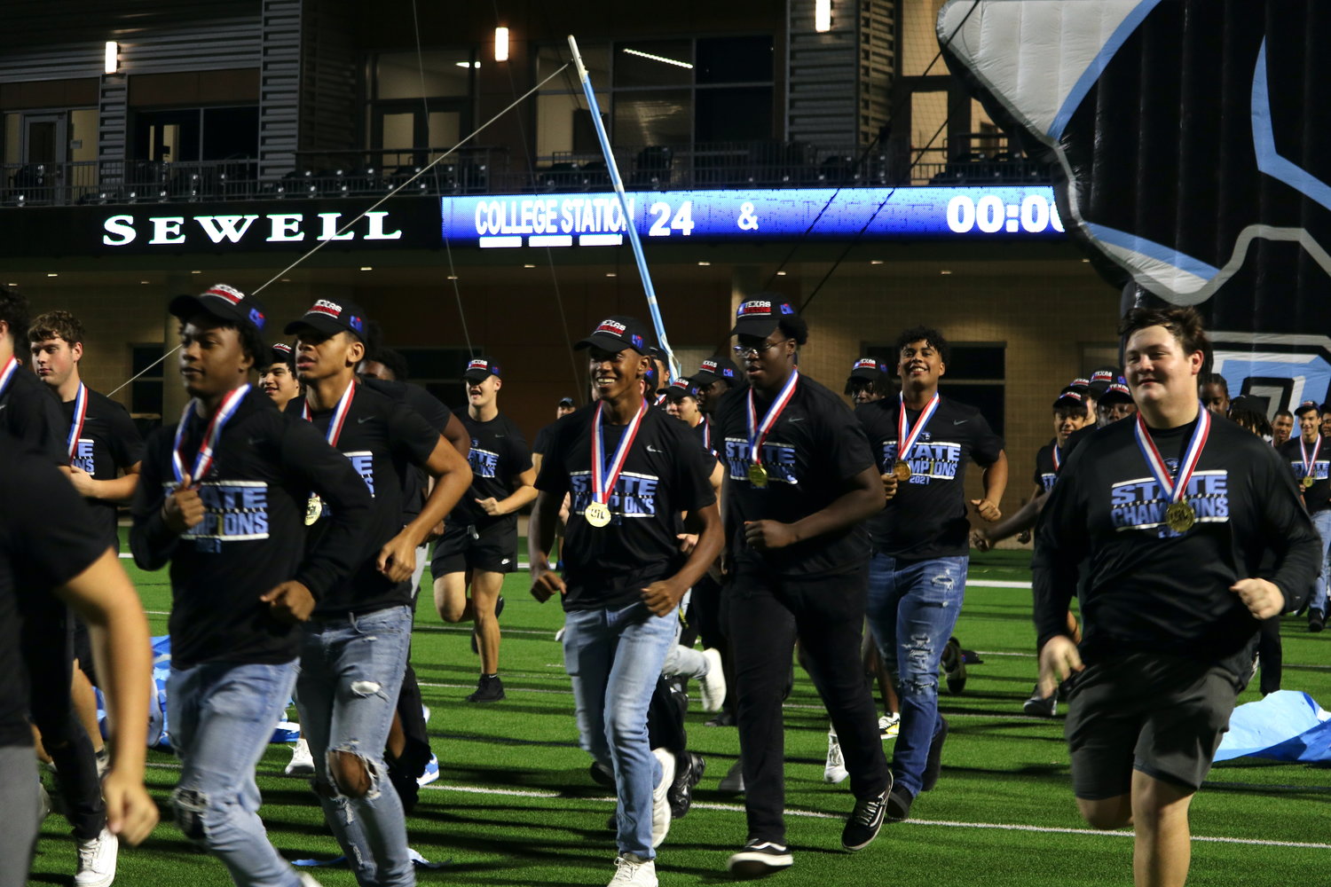 Paetow players run on the field during Wednesday's Paetow State Championship celebration at Legacy Stadium
