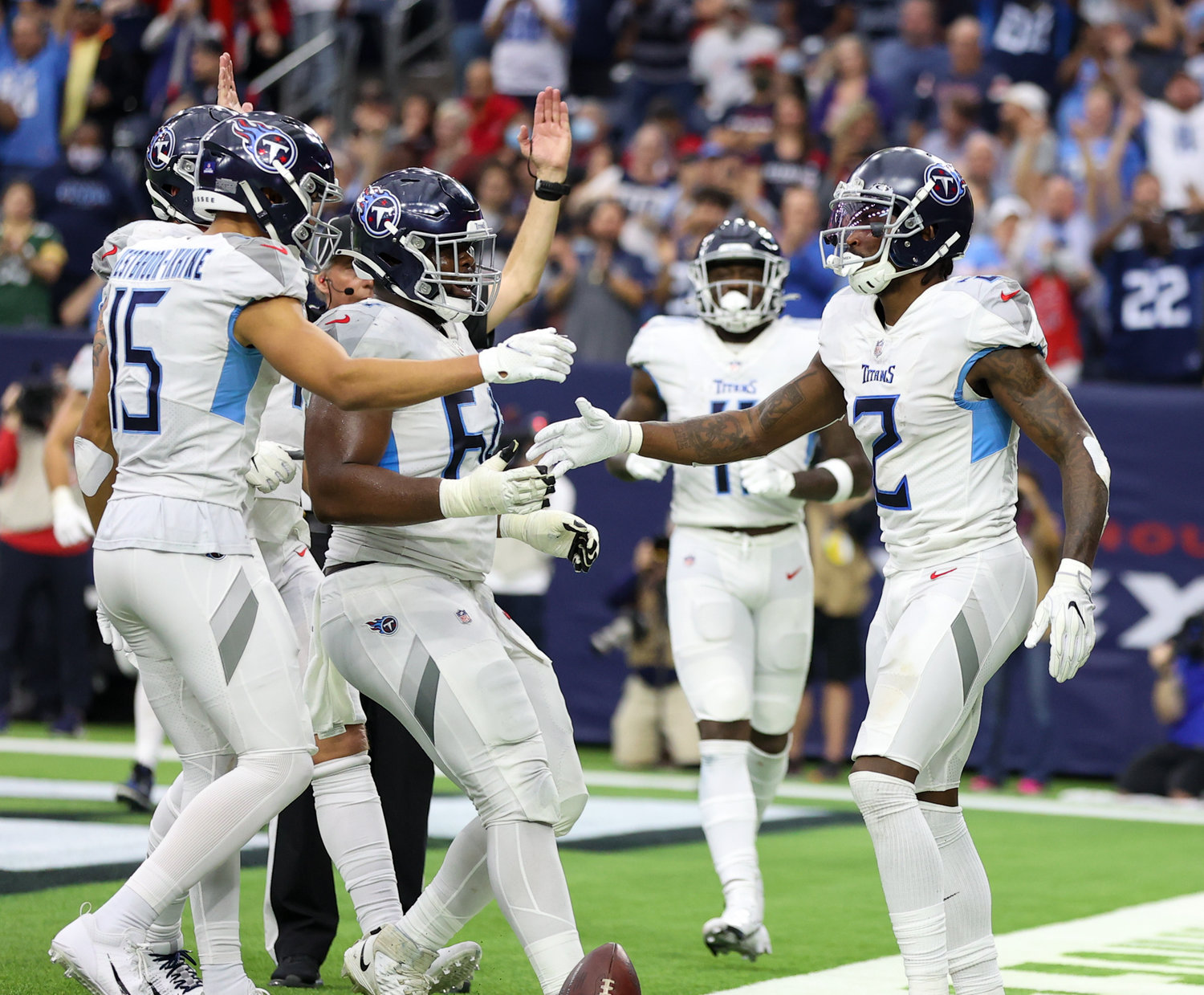 Teammates congratulate Tennessee Titans wide receiver Julio Jones (2) after a touchdown catch in the fourth quarter of an NFL game between the Texans and the Titans on Jan. 9, 2022 in Houston, Texas. The Titans won, 28-25.