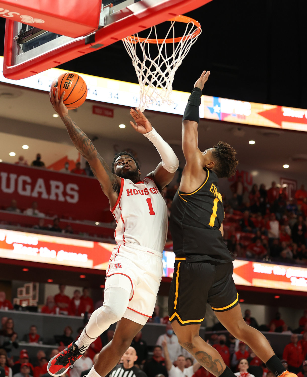 Houston Cougars guard Jamal Shead (1) goes to the basket against Wichita State Shockers guard Tyson Etienne (1) during an NCAA men’s basketball game on Jan. 8, 2022 in Houston, Texas.
