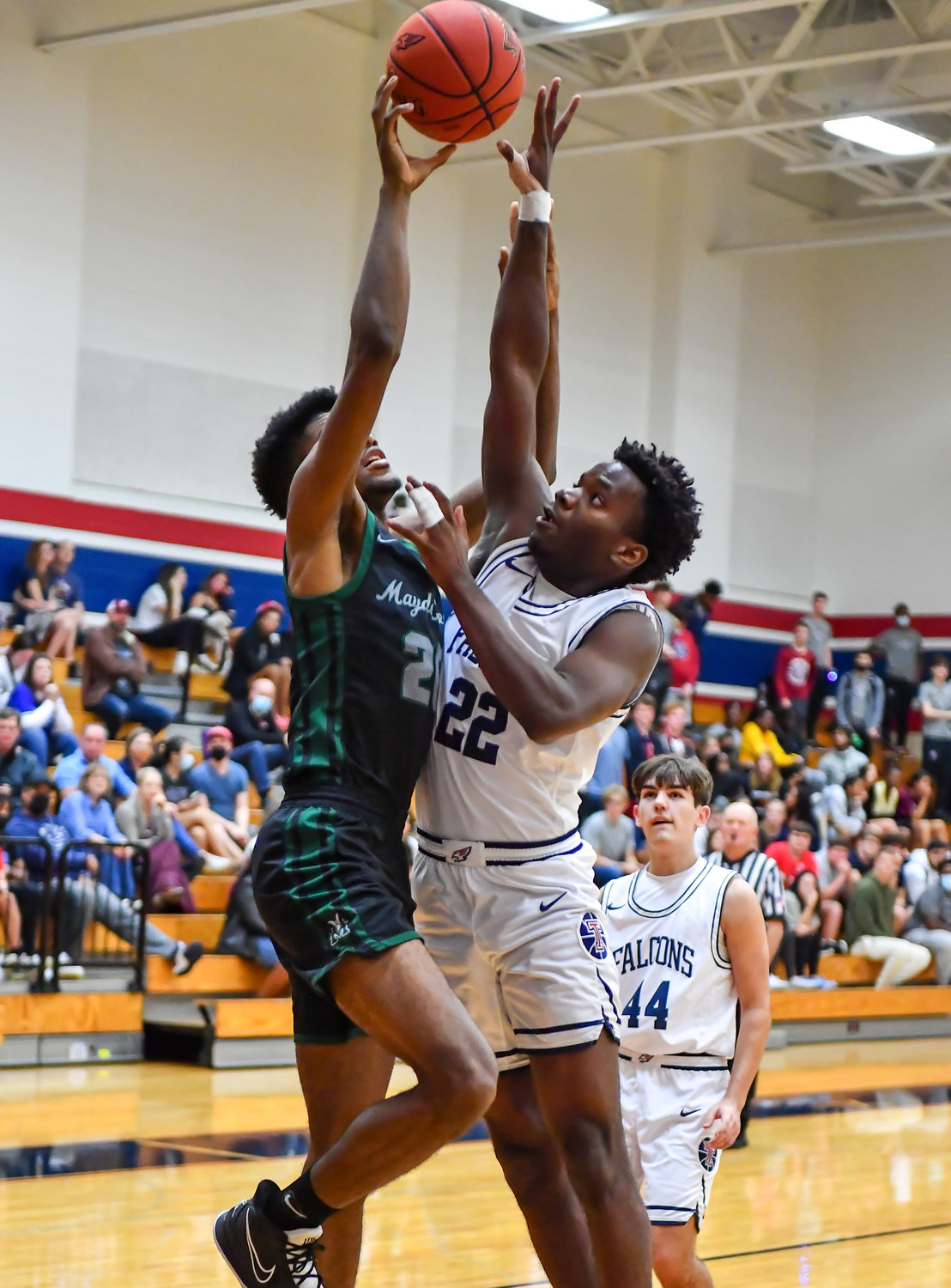 Katy Tx. Jan 14, 2022:   Mayde Creeks Jay Franklin #20 goes up for the shot guarded by Tompkins Don Ojiako #22 during the Tompkins vs Mayde Creek game.  (Photo by Mark Goodman / Katy Times)