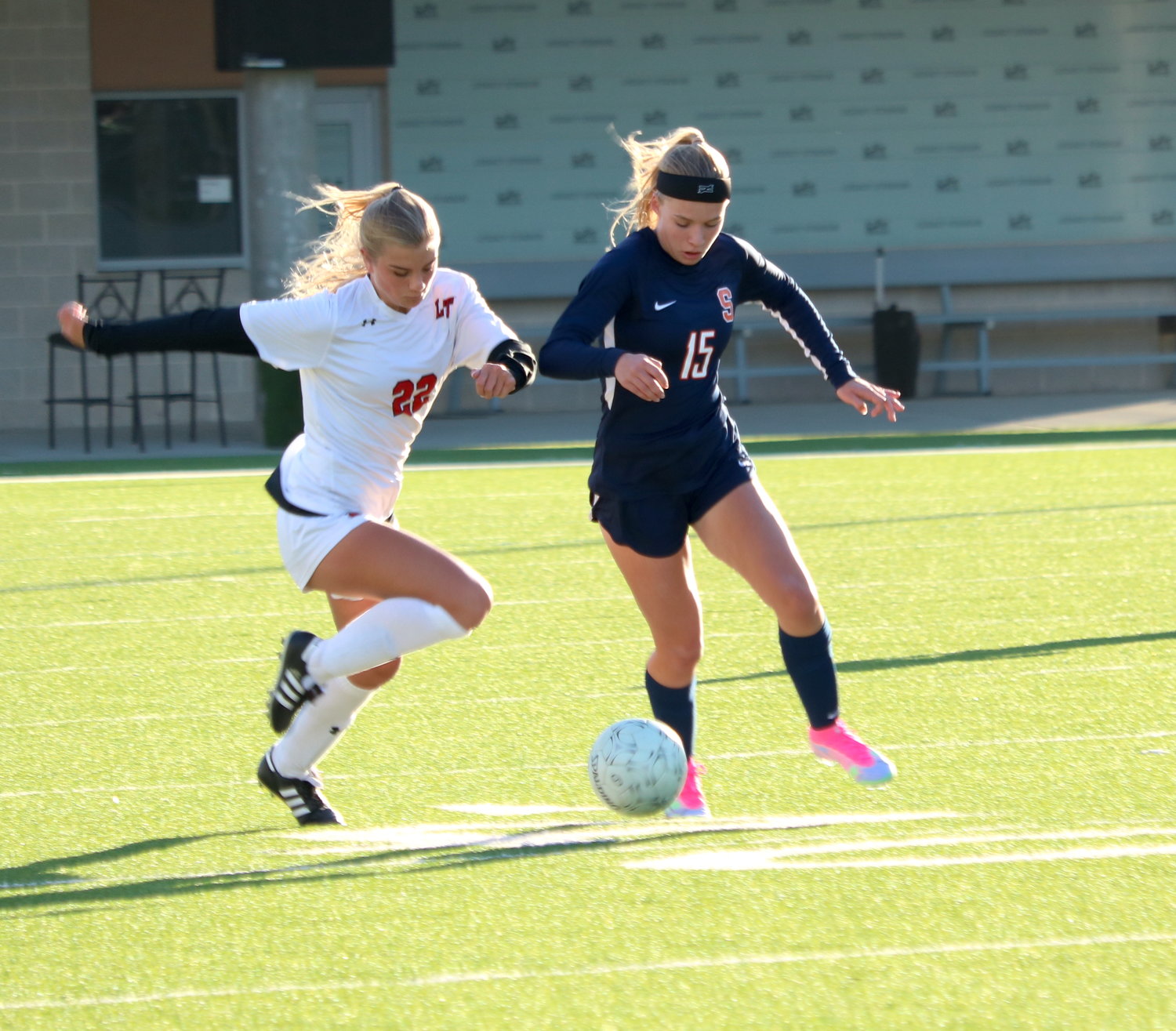 Kennedy Reed dribbles the ball during Saturday’s game between Seven Lakes and Lake Travis at Legacy Stadium.