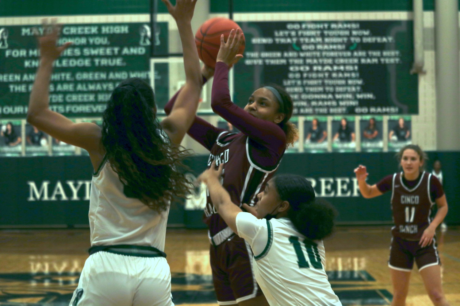 Cinco Ranch’s Danielle Williams shoots a 3-pointer during Friday’s District 19-6A game against Mayde Creek at the Mayde Creek gym.