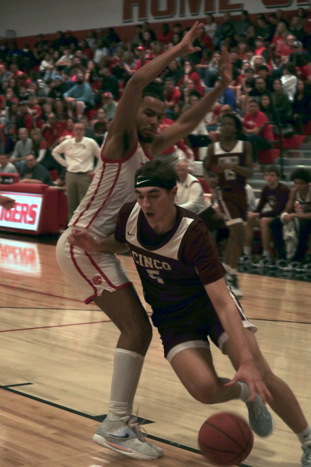 Cinco Ranch’s Hunter Betke drives to the basket during Saturday’s game against Katy at the Katy gym.