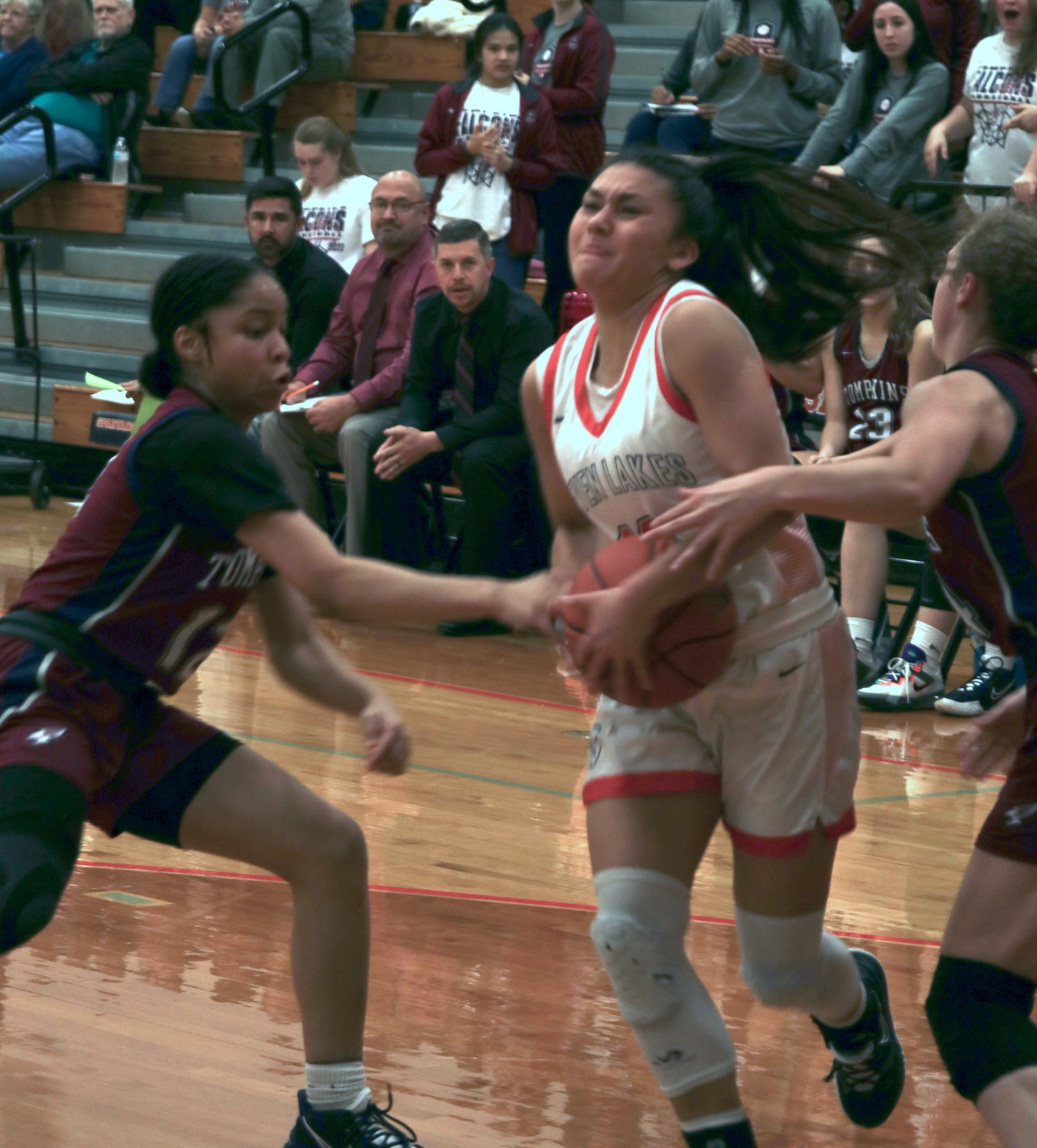 Seven Lakes’ Cailyn Tucker fights through contact during Tuesday’s game against Tompkins at the Seven Lakes gym.