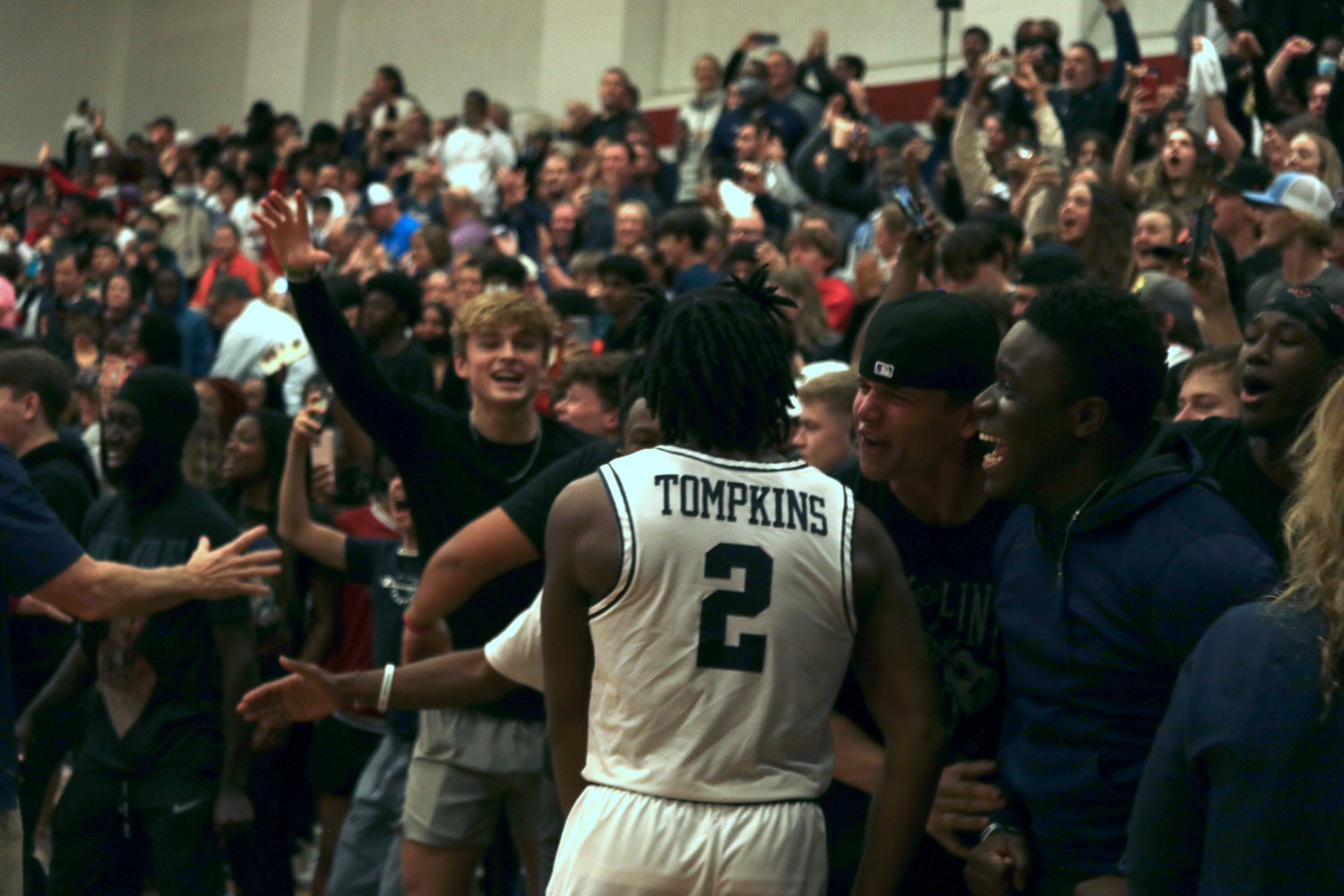 Tompkins’ Nick Lancit celebrates with fans after Wednesday’s game against Seven Lakesat the Tompkins gym.