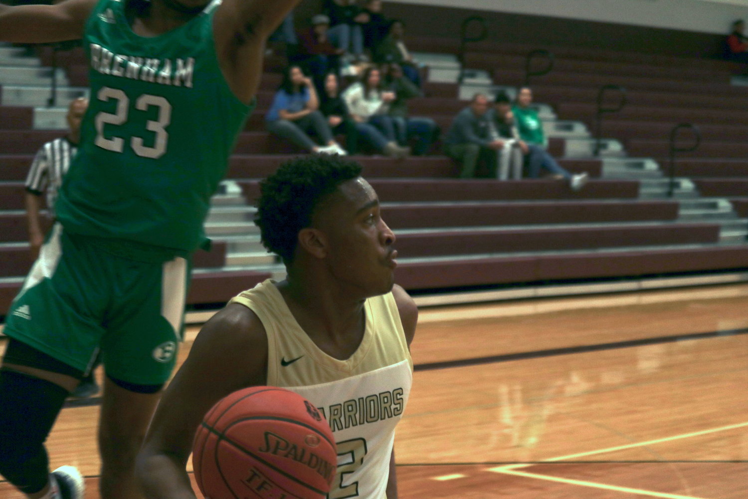 ordan’s Shawn Mitchell drives the baseline during Saturday’s game against Brenham at the Cinco Ranch gym.