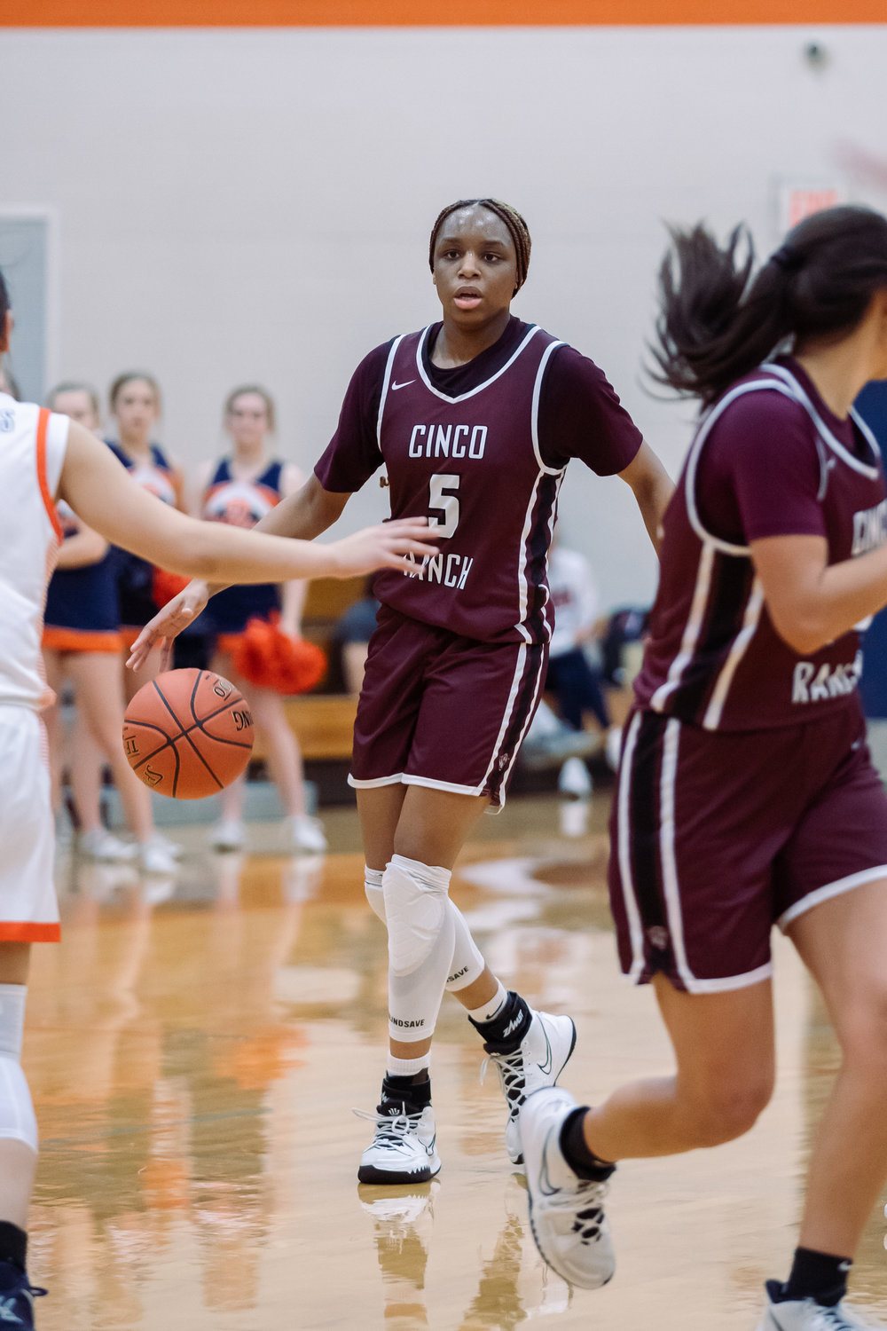 Cinco Ranch's Aniya Foy dribbles the ball up the court during Tuesday's game against Seven Lakes.