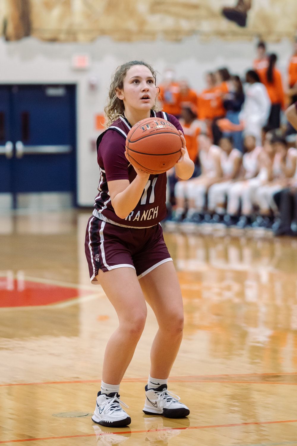Cinco Ranch's Isabella Hartl shoots a free throw dribbles the ball up the court during Tuesday's game against Seven Lakes.