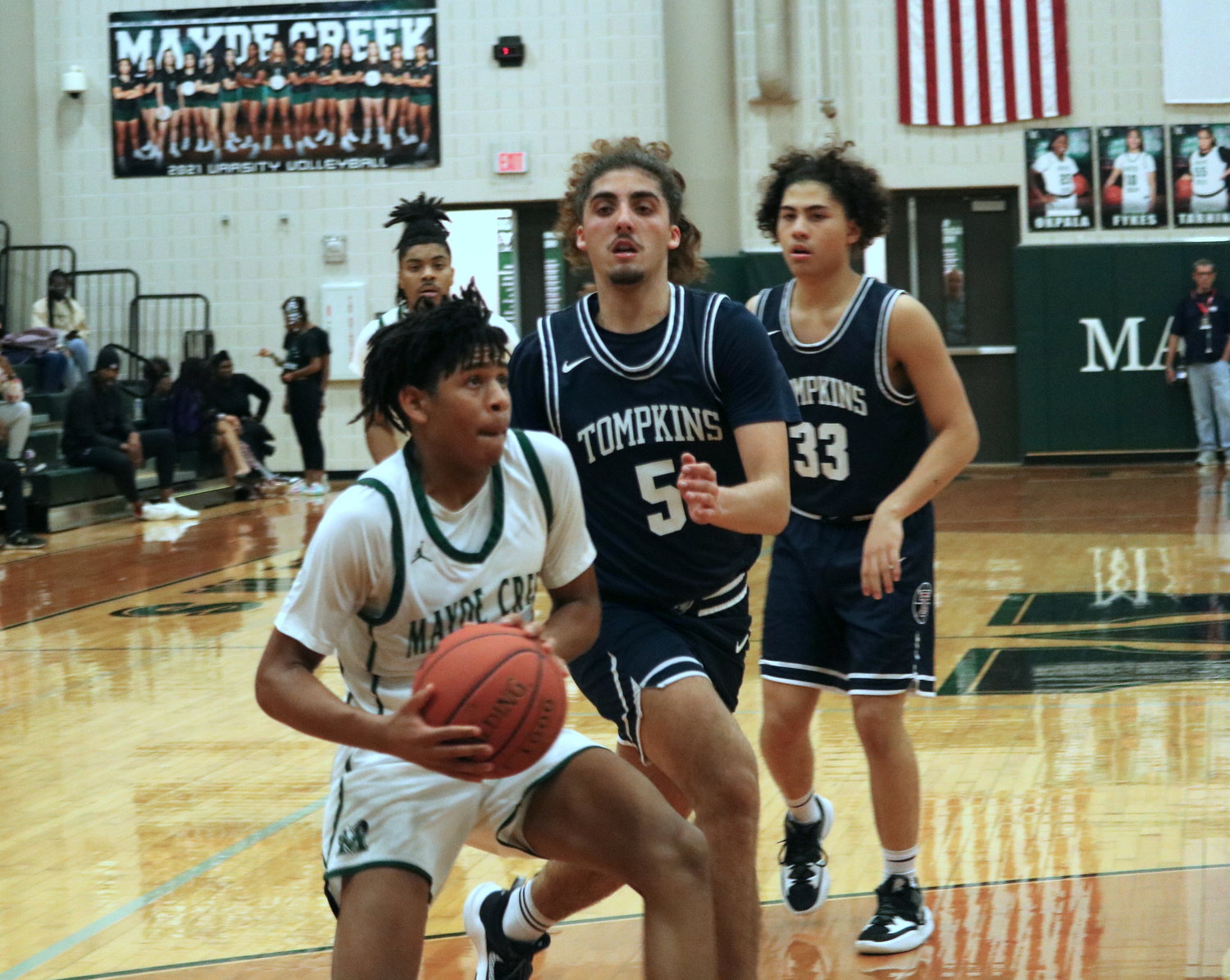 Larison Lamette drives to the lane during Wednesday’s game between Mayde Creek and Tompkins at the Mayde Creek gym.