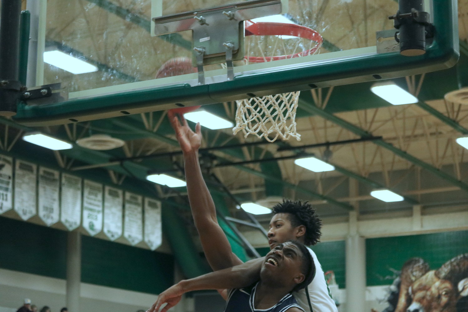 Jason Clark gets a layup and a foul during Wednesday’s game between Mayde Creek and Tompkins at the Mayde Creek gym.