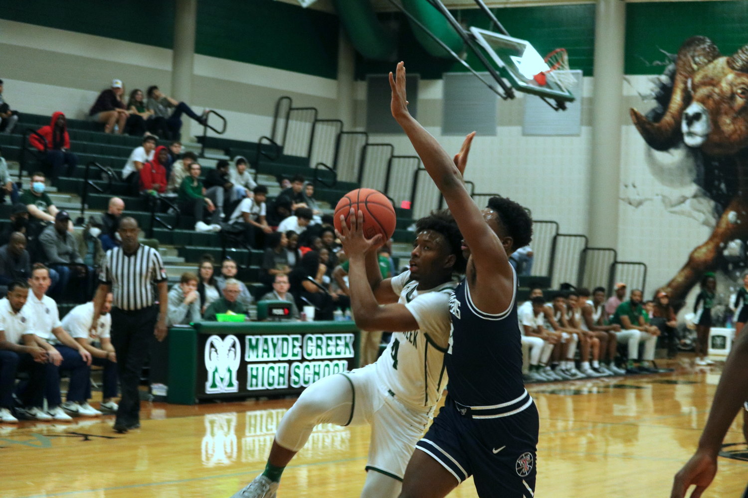 Angel Sonnier drives to the basket during Wednesday’s game between Mayde Creek and Tompkins at the Mayde Creek gym.