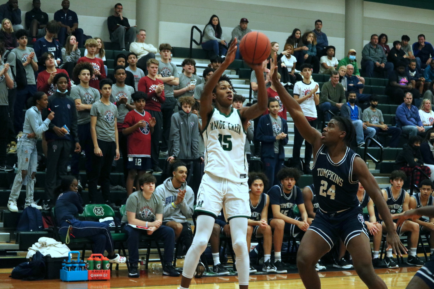Jamal Chretien shoots a 3-pointer during Wednesday’s game between Mayde Creek and Tompkins at the Mayde Creek gym.