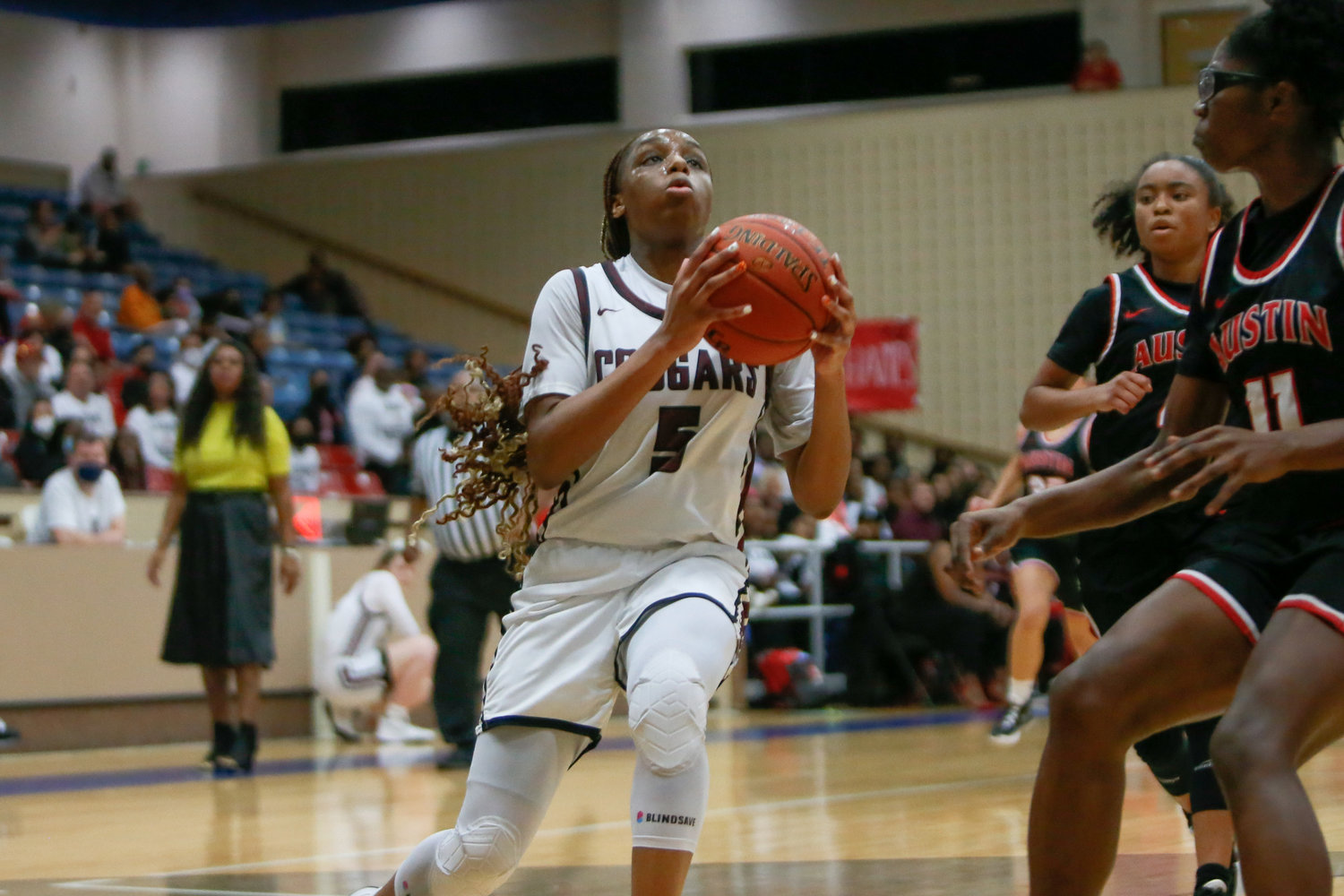 Aniya Foy shoots a layup during Tuesday's game between Cinco Ranch and Fort Bend Autin.