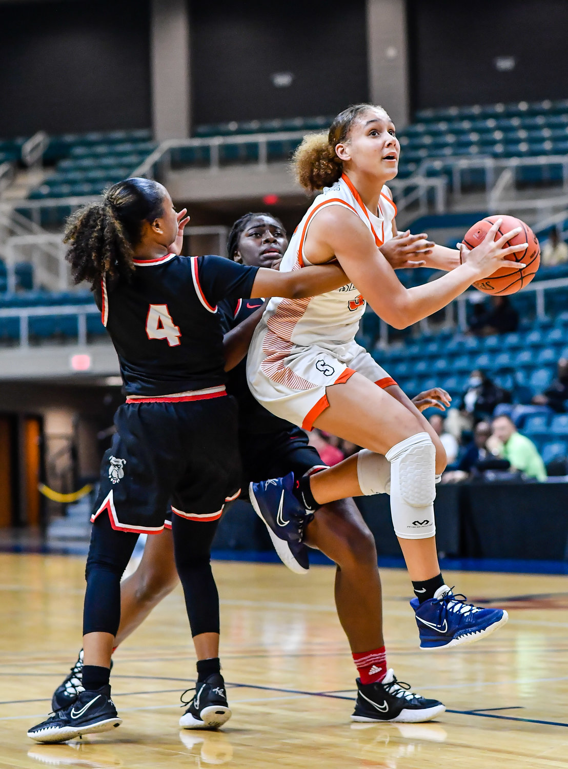 Katy Tx. Feb 22, 2022:  Seven Lakes Justice Carlton #30 drives to the basket during the Regional Quarterfinal playoff game, Seven Lakes vs Fort Bend Austin at the Merrell Center. (Photo by Mark Goodman / Katy Times)