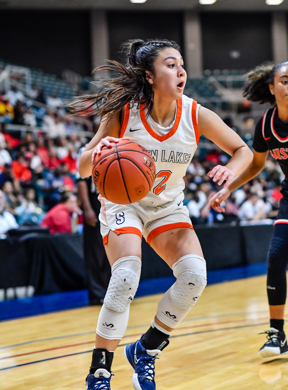Katy Tx. Feb 22, 2022:  Seven Lakes Cailyn Tucker #12 drives the baseline during the Regional Quarterfinal playoff game, Seven Lakes vs Fort Bend Austin at the Merrell Center. (Photo by Mark Goodman / Katy Times)