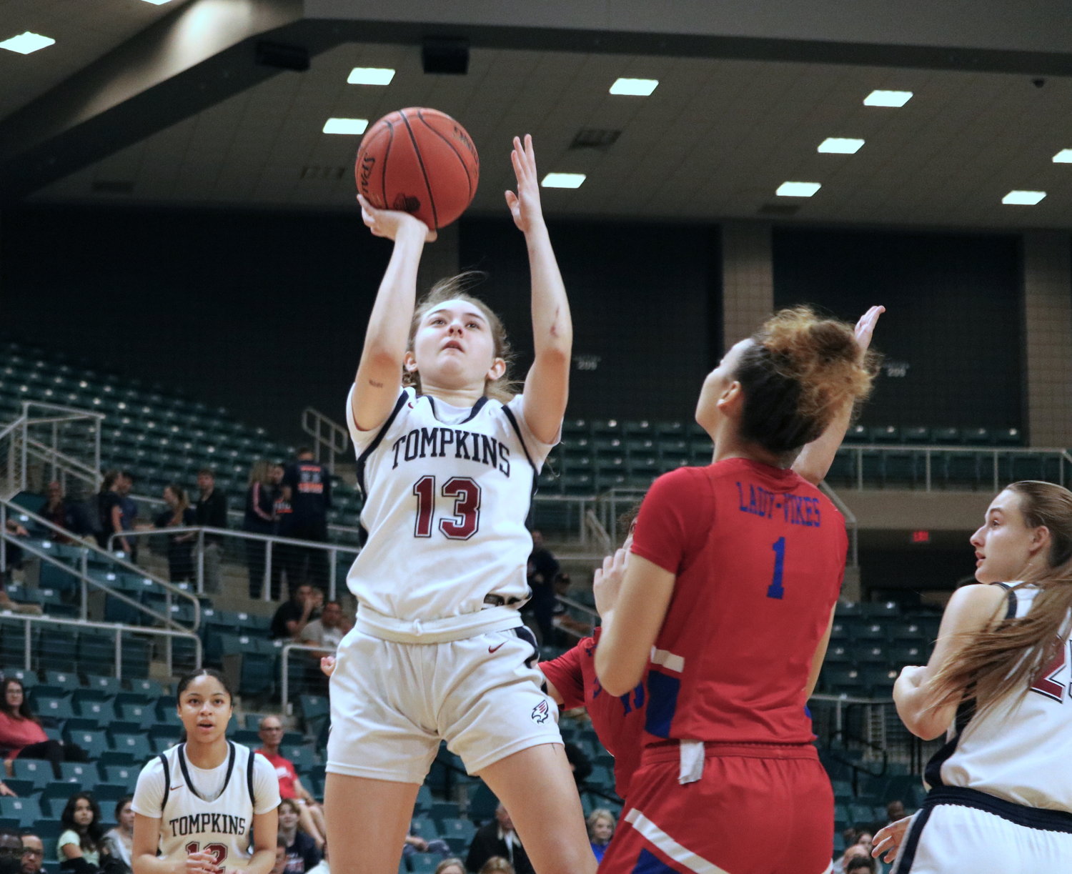 Tompkins’ Macy Spencer shoots a jumper during Tuesday’s Class 6A regional quarterfinal against Fort Bend Dulles at the Merrell Center.