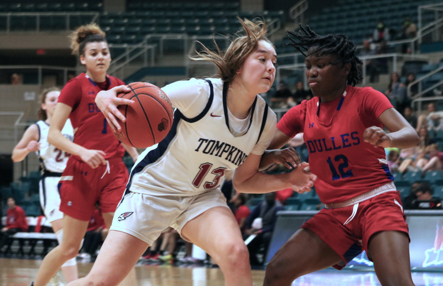 Tompkins’ Macy Spencer fights through contact during Tuesday’s Class 6A regional quarterfinal against Fort Bend Dulles at the Merrell Center.
