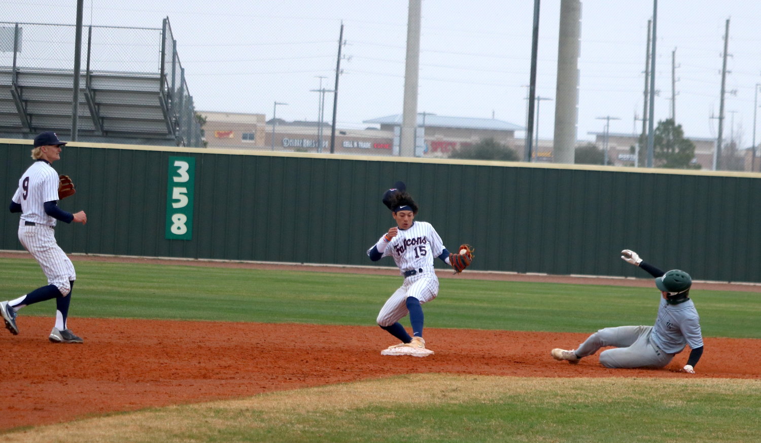 Ivan Gomez steps on second base to record an out during Thursday’s game between Tompkins and San Antonio Reagan at the Tompkins baseball field.