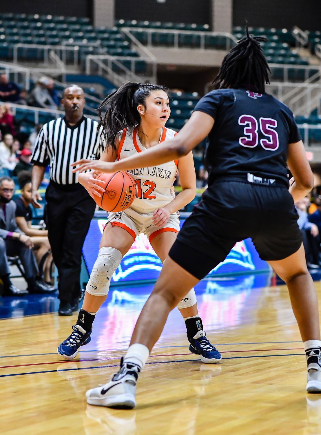 Katy Tx. Feb 25, 2022:  Seven Lakes Cailyn Tucker #12 looks for an open player during the Regional SemiFinal playoff game, Seven Lakes vs Pearland at the Merrell Center. (Photo by Mark Goodman / Katy Times)