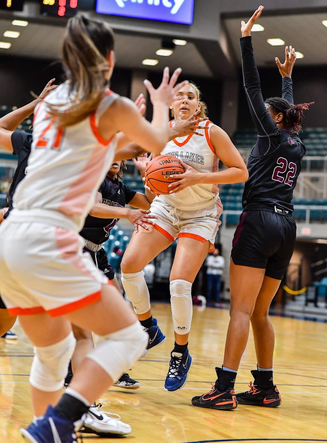 Katy Tx. Feb 25, 2022:  Seven Lakes Justice Carlton #30 drives to the basket heavily guarded by Pearland defenders during the Regional SemiFinal playoff game, Seven Lakes vs Pearland at the Merrell Center. (Photo by Mark Goodman / Katy Times)