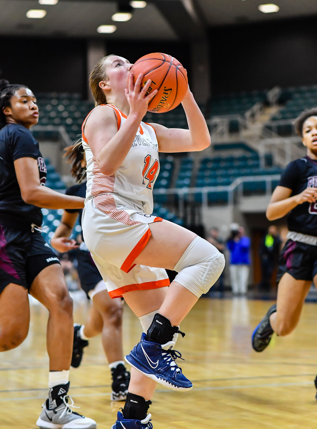 Katy Tx. Feb 25, 2022:  Seven Lakes Shea Mcfarland #14 drives to the basket during the Regional SemiFinal playoff game, Seven Lakes vs Pearland at the Merrell Center. (Photo by Mark Goodman / Katy Times)