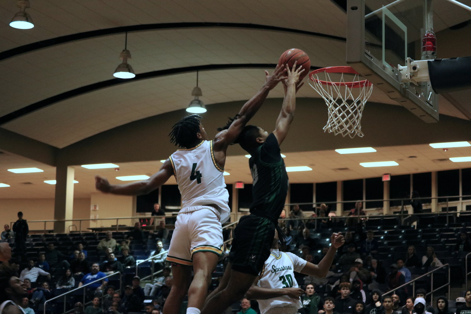 Landon Bean attempts to dunk during Friday’s game between Mayde Creek and Stratford at the Coleman Coliseum.