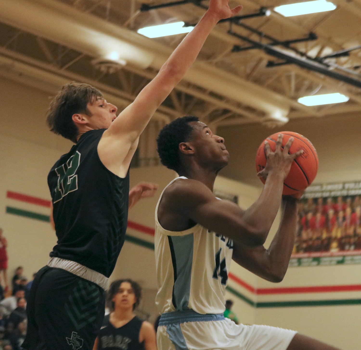 Abou Camara shoots a reverse layup during Monday’s game between Paetow and Kingwood Park at The Woodlands High School.