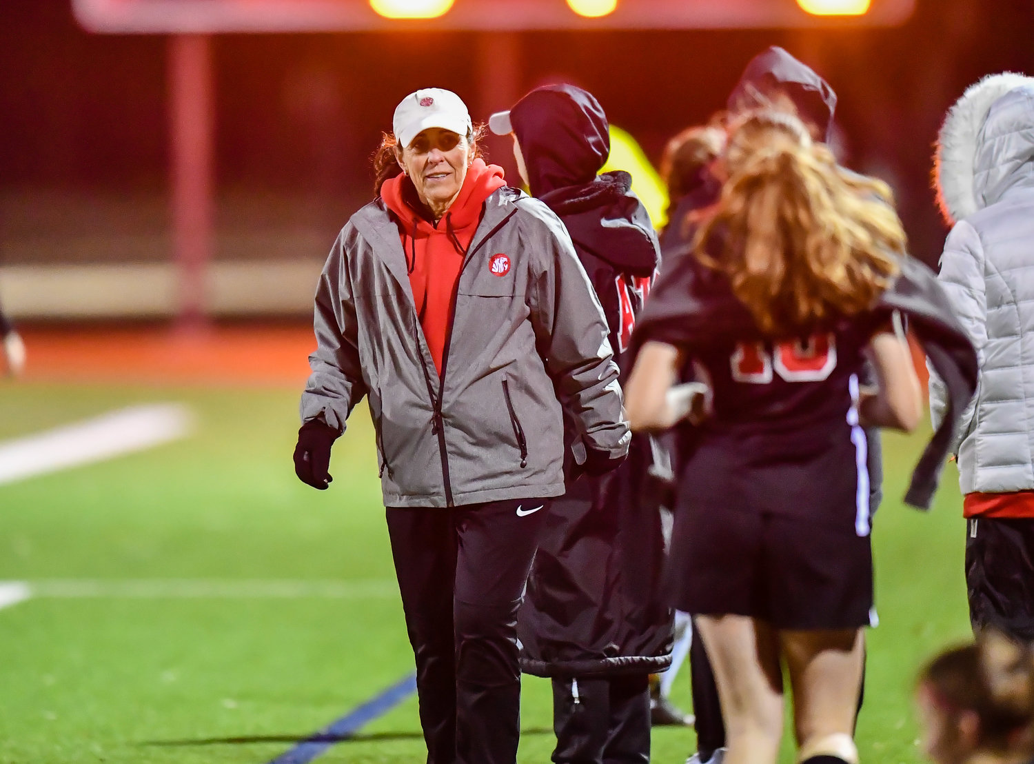 March 8,, 2022: Katy's head coach Dianne Loftin picks up the win in her final home game during their soccer match against Katy Taylor. (Photo by Mark Goodman / Katy Times)