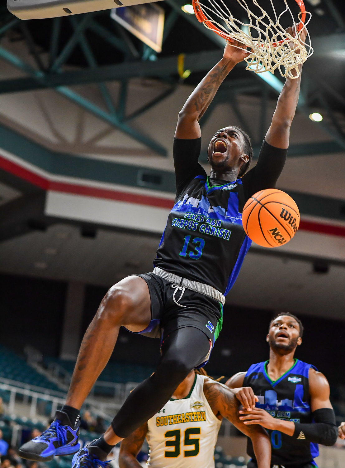 March 12,, 2022:  A&M-Corpus Christis De'Lazarus Keys #13 gets the slam dunk during the Southland Conference Basketball Championship between A&M Corpus Christi vs Southeastern Louisiana. (Photo by Mark Goodman / Katy Times)