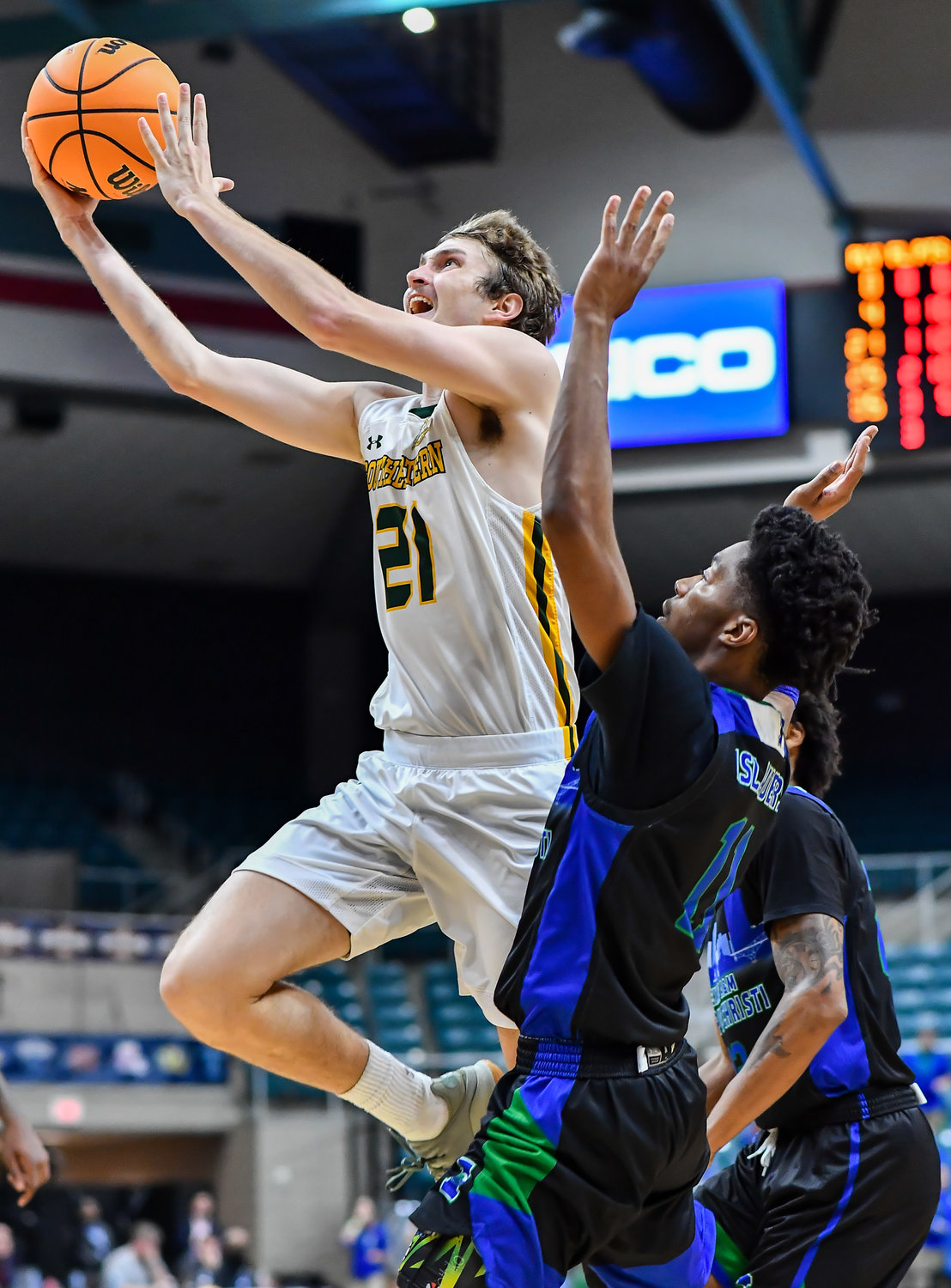 March 12,, 2022:  Southeastern Louisianas Ryan Burkhardt #21 drives up to the basket during the Southland Conference Basketball Championship game between A&M Corpus Christi vs Southeastern Louisiana. (Photo by Mark Goodman / Katy Times)