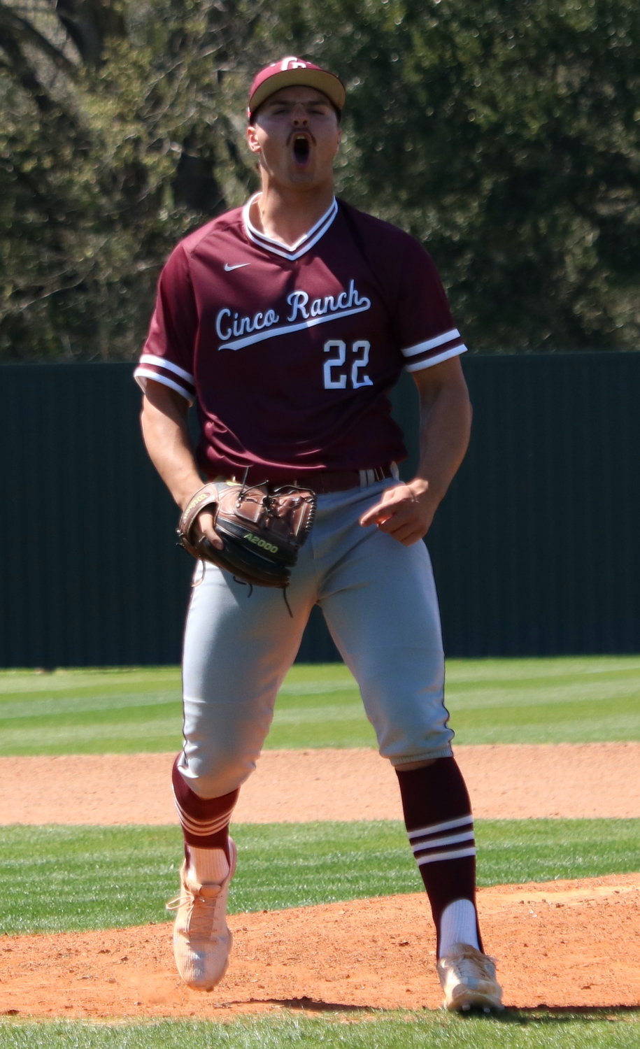 Blake Hansen celebrates after getting out of a jam during a game between Katy and Cinco Ranch at the Katy baseball field.