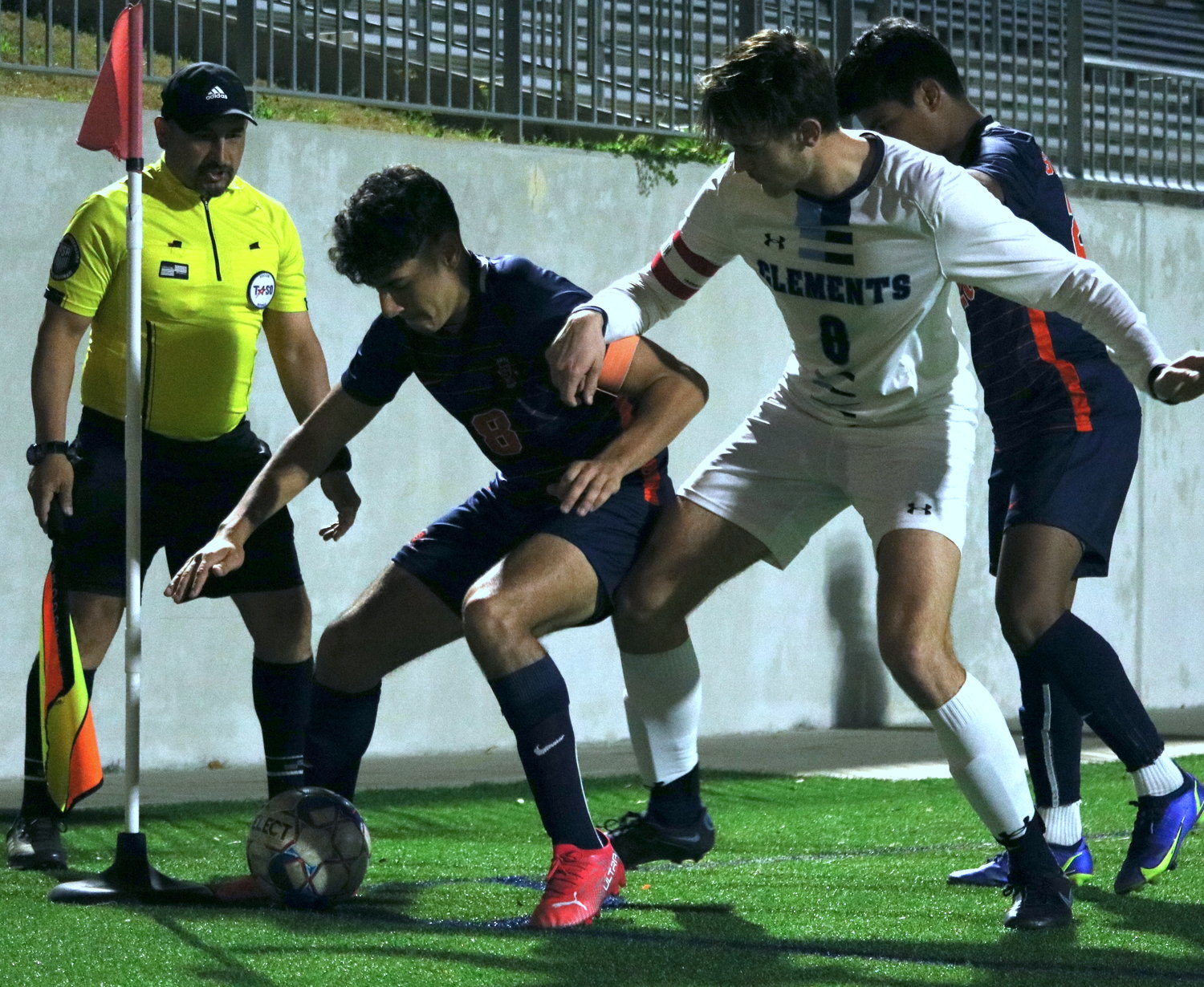 Javier Rivas fights to keep the ball in the corner during Thursday’s Class 6A bi-district game between Seven Lakes and Fort Bend Clements at Legacy Stadium.