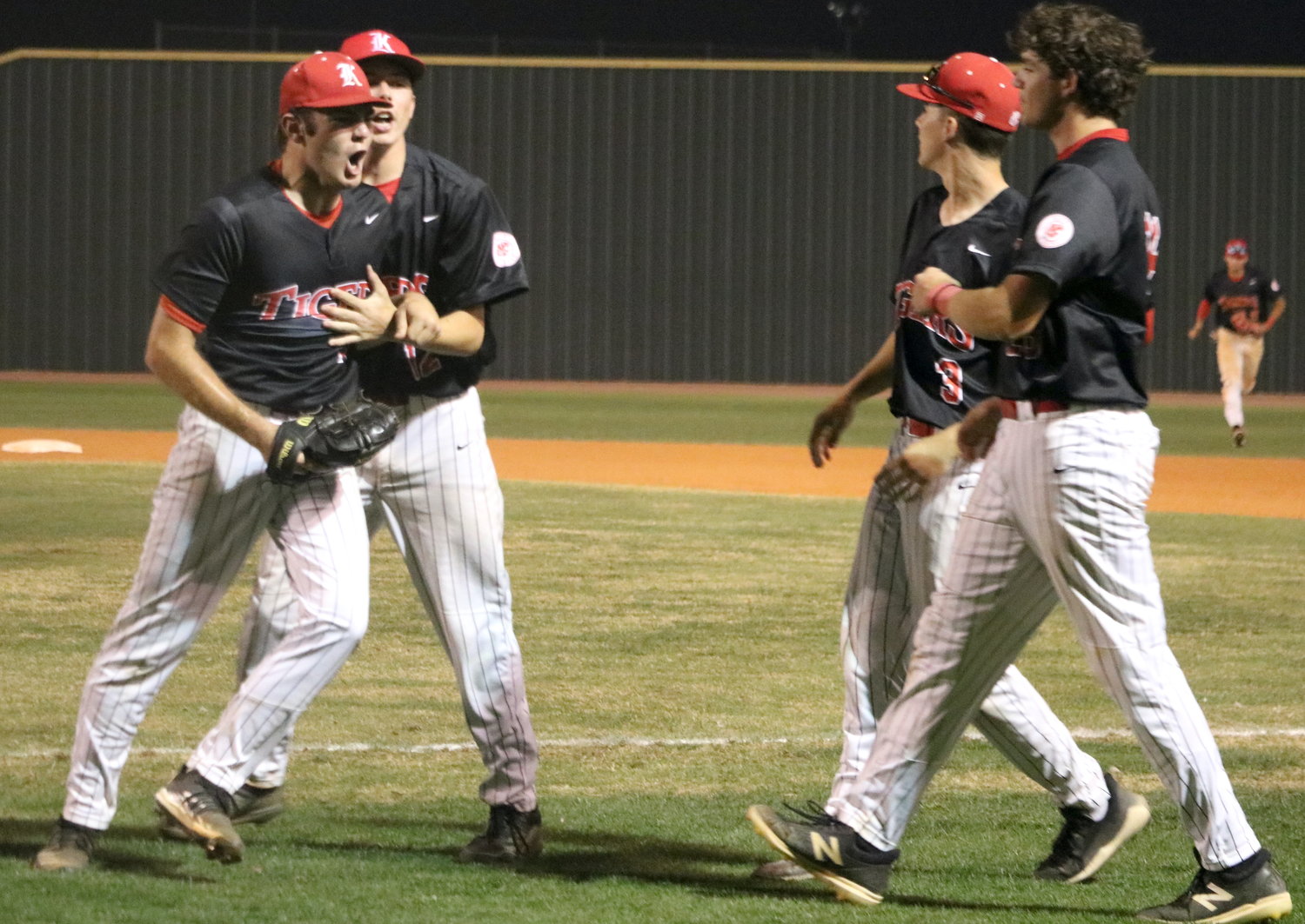 Brayden Powers celebrates after getting out of a jam during Tuesday’s District 19-6A game between Katy and Tompkins at the Tompkins baseball field.