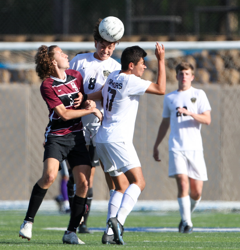 Jordan midfielder Marcelo Ojeda (8) heads the ball during the Class 5A boys state semifinal between Dripping Springs and Katy Jordan on April 14, 2022 in Georgetown, Texas.