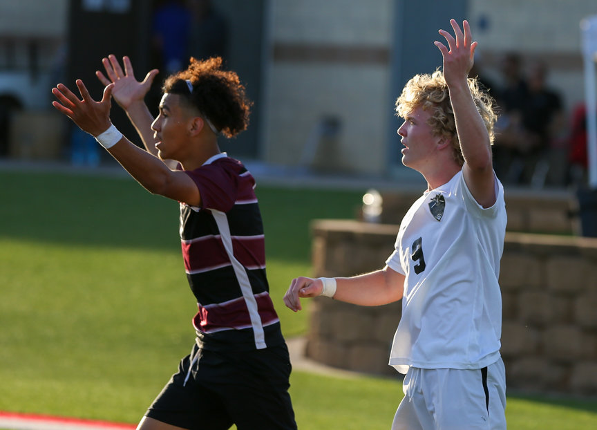 Jordan forward Cole Vernon (9) and Dripping Springs defender Diego Zamudio (6) react after a play during the Class 5A boys state semifinal between Dripping Springs and Katy Jordan on April 14, 2022 in Georgetown, Texas.