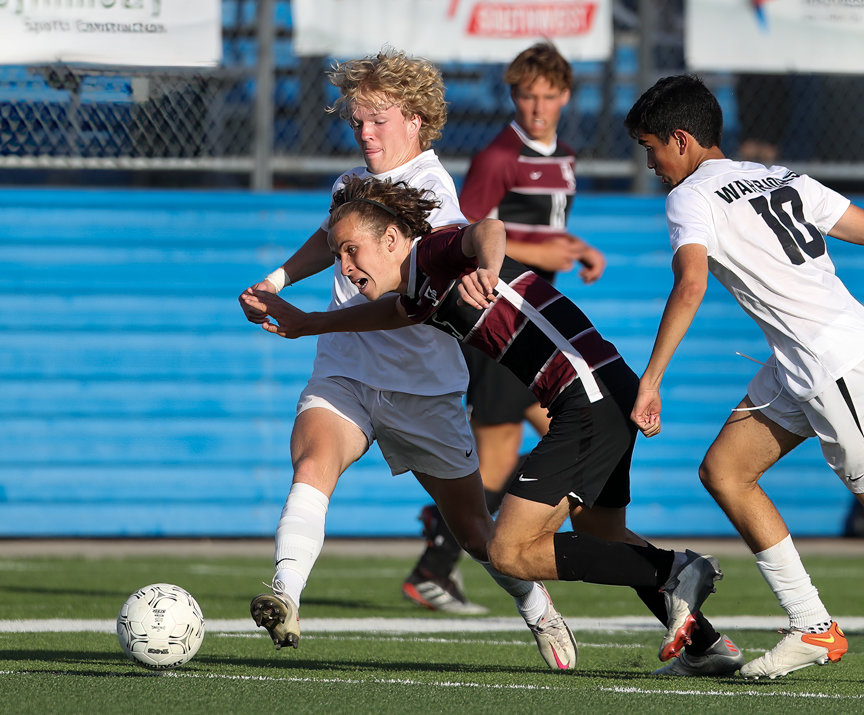 Jordan forward Cole Vernon (9) works against Dripping Springs midfielder Mason Russell (5) during the Class 5A boys state semifinal between Dripping Springs and Katy Jordan on April 14, 2022 in Georgetown, Texas.