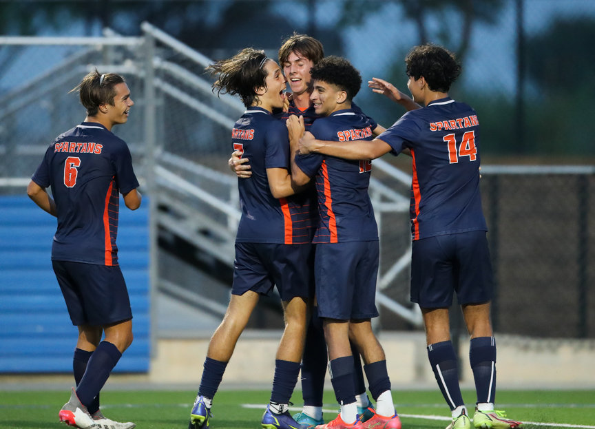 Teammates congratulate Seven Lakes midfielder Aidan Morrison (10) after scoring a goal on a penalty kick during the first half of the Class 6A boys state semifinal between Katy Seven Lakes and Plano on April 15, 2022 in Georgetown, Texas.