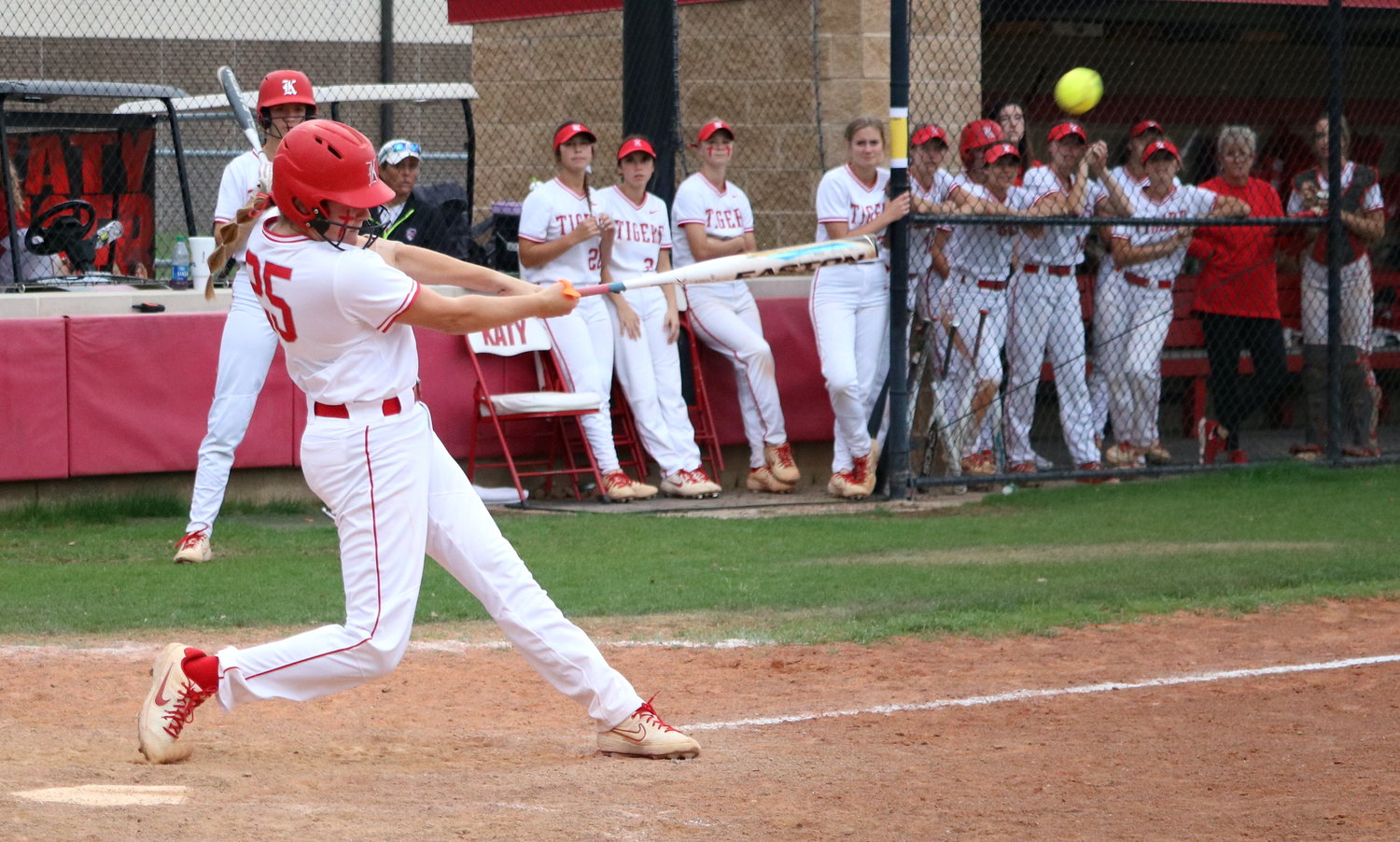 Cameryn Harrison hits a ball to left field during Tuesday’s game between Katy and Taylor at the Katy softball field.