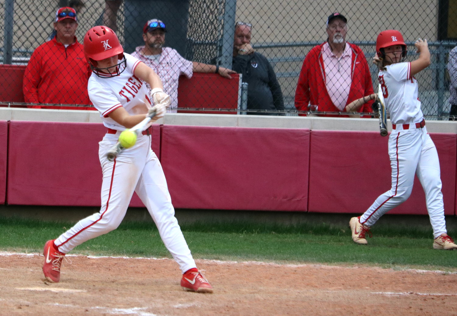 Hailey Gore hits during Tuesday’s game between Katy and Taylor at the Katy softball field.