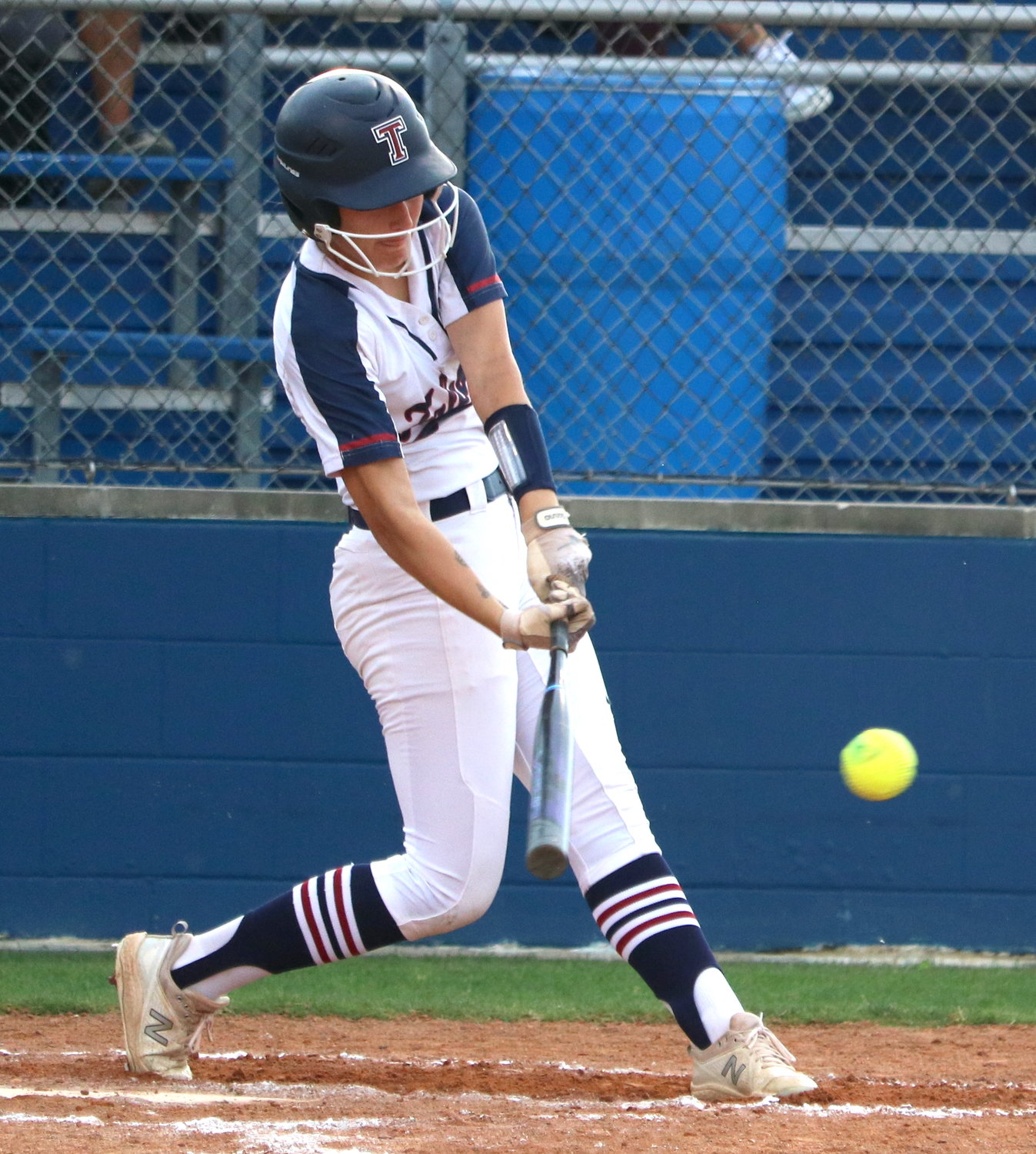 Kennedy Bourque hits during Thursday’s bi-district game between Tompkins and George Ranch at the Tompkins softball field.