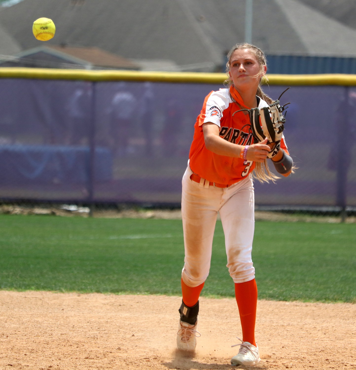 Mackenzie Stutts makes a throw to first base during Saturday’s bi-district round game between Seven Lakes and Ridge Point at the Ridge Point softball field.