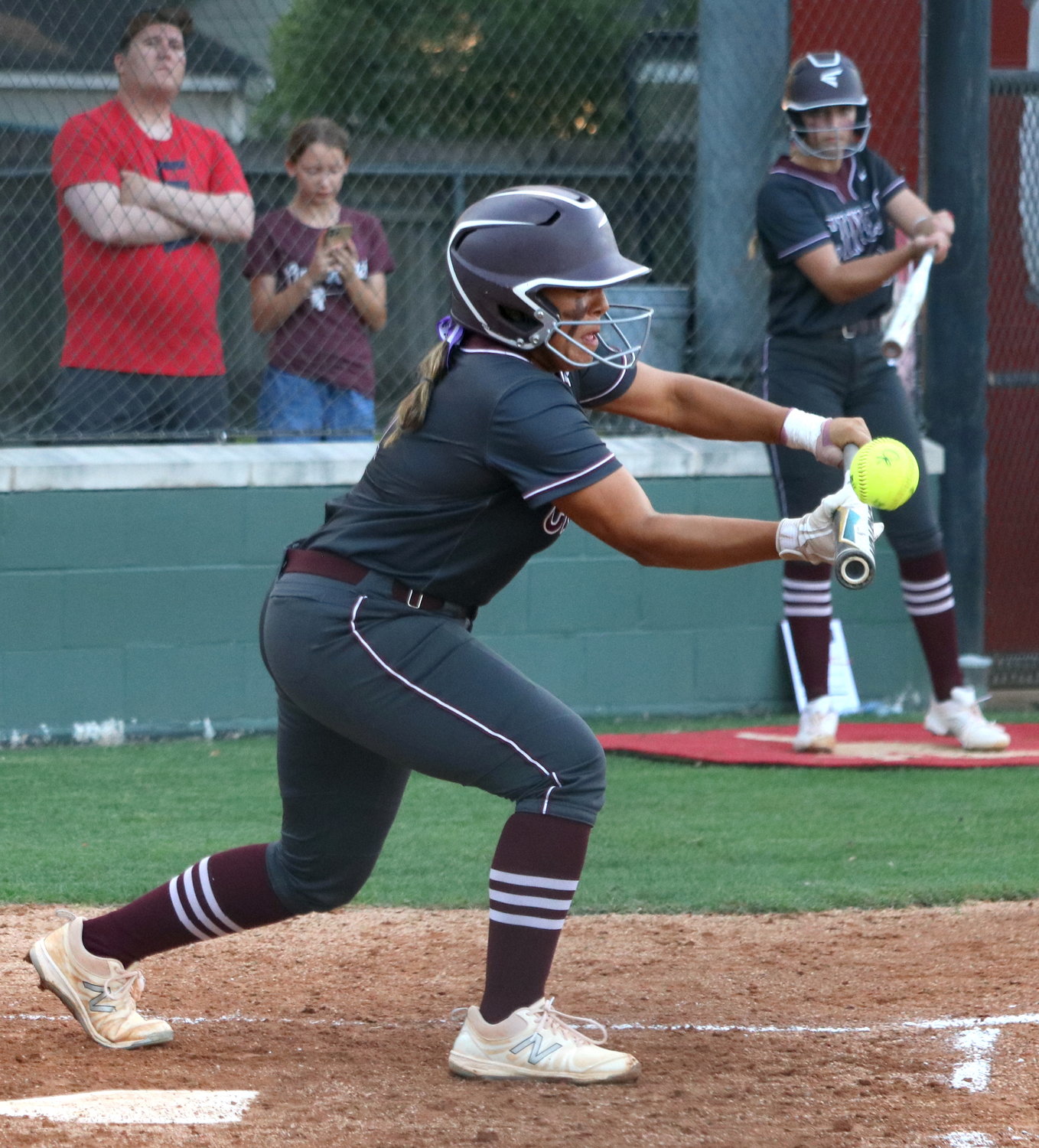 Mariah Hinojosa bunts during Friday's area round game between Cinco Ranch and Heights at Memorial High School.