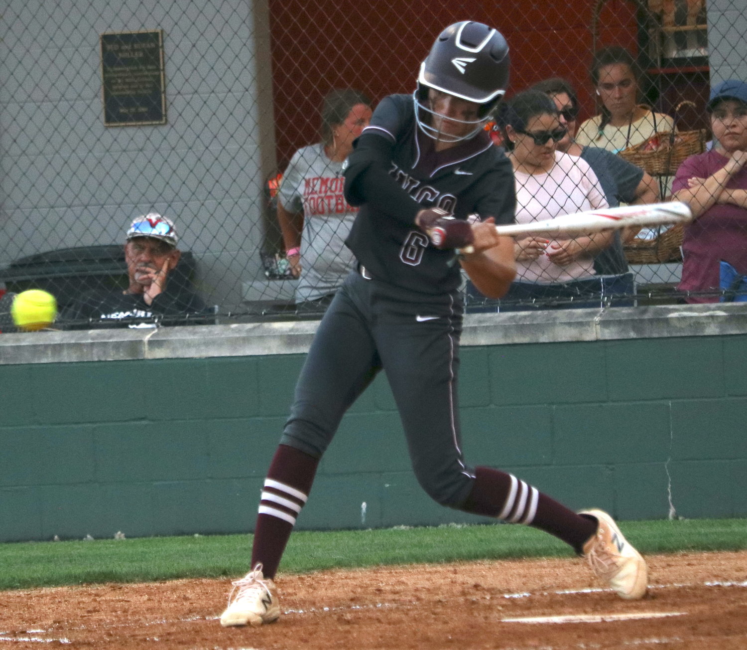 Faith Piper hits during Friday's area round game between Cinco Ranch and Heights at Memorial High School.