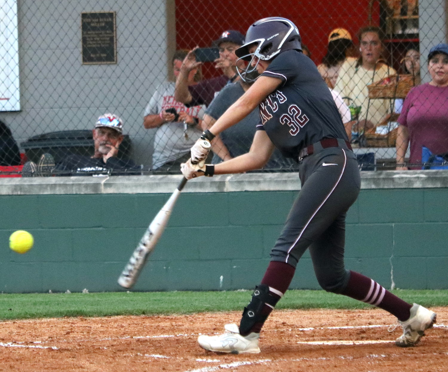 Krista Burg hits during Friday's area round game between Cinco Ranch and Heights at Memorial High School.