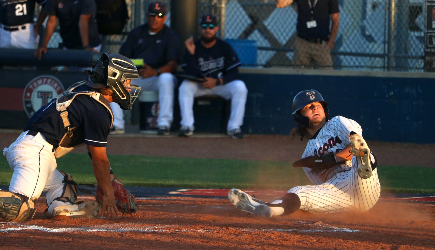 Ty Dagley steals home plate during Thursday’s Class 6A area round game between Tompkins and Lamar at the Tompkins baseball field.