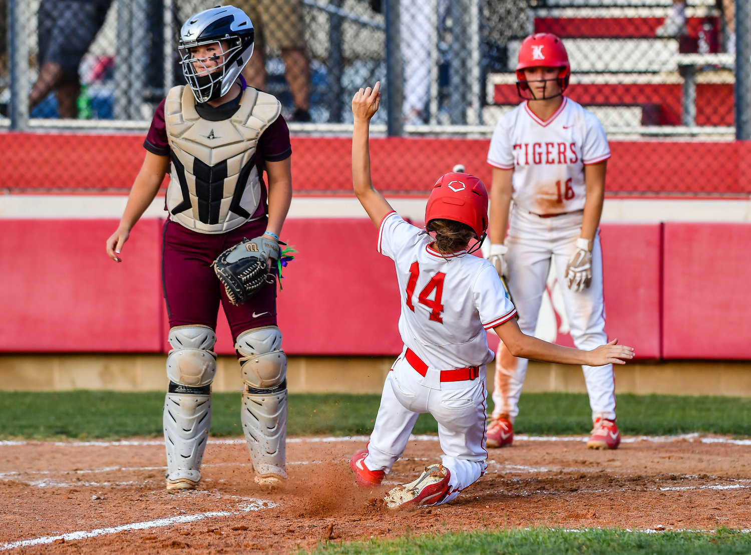 May 13, 2022: Katy's Haley Lance #14 slides safely into home plate during Regional Quarterfinal playoff between Katy and Cinco Ranch at Katy HS. (Photo by Mark Goodman / Katy Times)